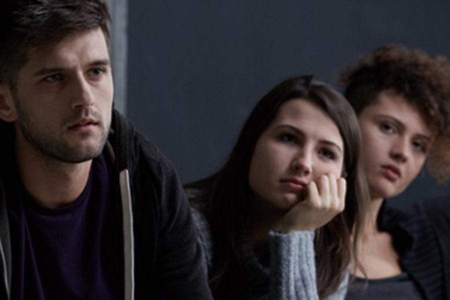 A group of people listening to a lecture