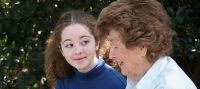A young person chatting to their grandparent